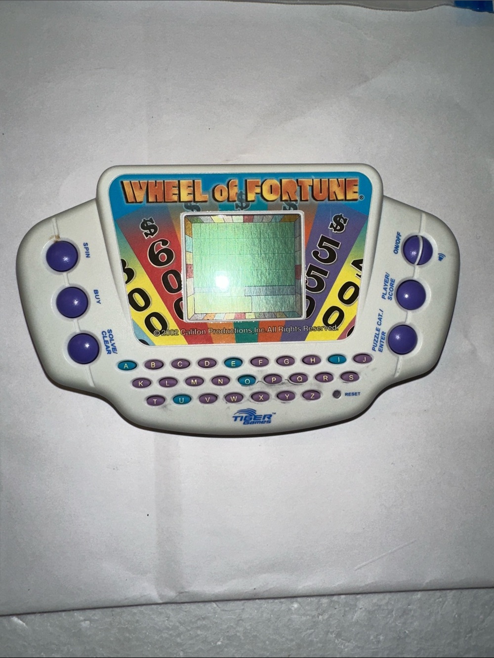Vintage Wheel of Fortune handheld game (2003). Parts only.